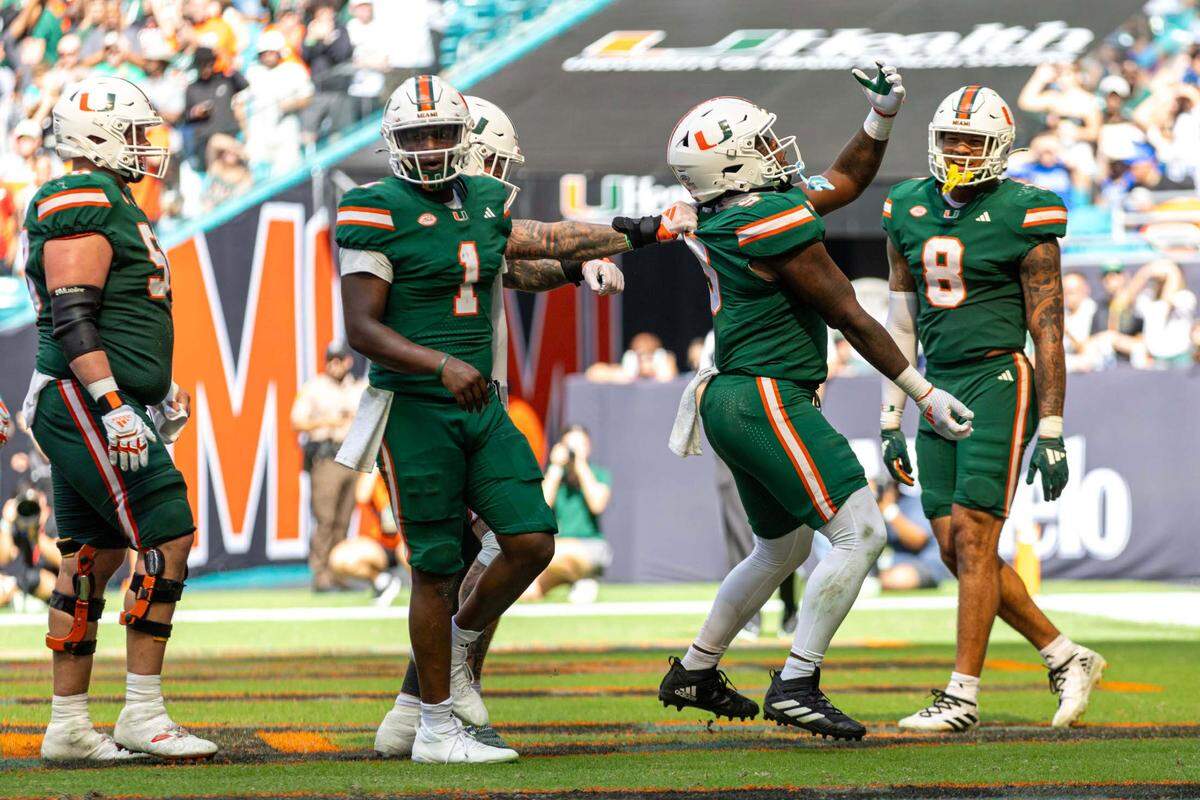 Miami Hurricanes tight end Elija Lofton (9) reacts with teammates after scoring a touchdown during the second half of an ACC football game against the Duke Blue Devils at Hard Rock Stadium on Saturday, Nov. 2, 2024, in Miami Gardens, Fla.