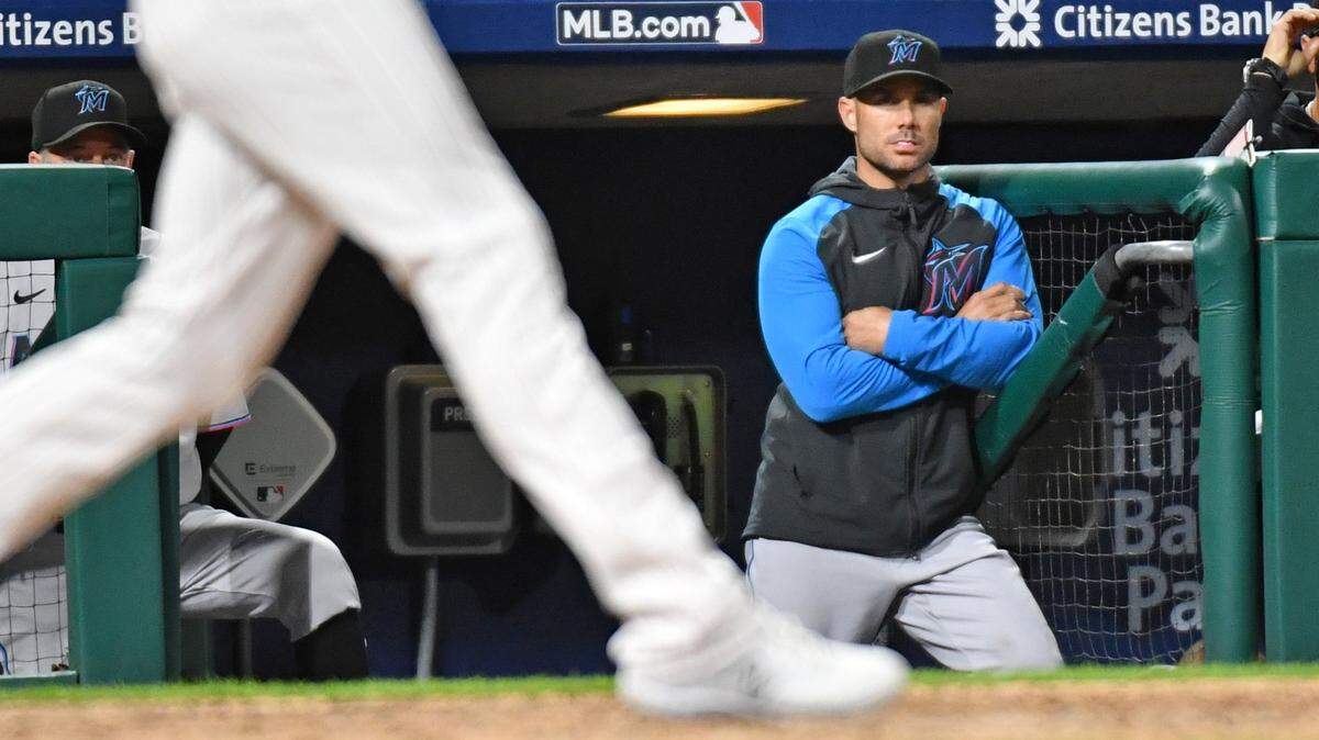 Miami Marlins manager Skip Schumaker (55) watches from the dugout against the Philadelphia Phillies during the sixth inning at Citizens Bank Park on Monday, April 10, 2023.