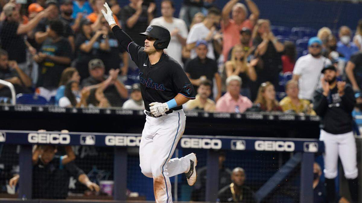 Miami Marlins Nick Fortes (84) raises his hand to the crowd after scoring a two-run home run during the fifth inning of a baseball game against the Pittsburgh Pirates, Saturday, Sept. 18, 2021, in Miami. (AP Photo/Marta Lavandier)
