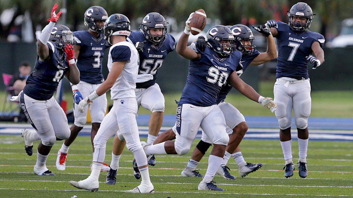 Columbus players celebrate as they lead against the Palmetto during the second quarter of the Columbus Explores Varsity Football  vs Miami Palmetto Varsity football game at Tropical Park on Thursday, November 15, 2018.