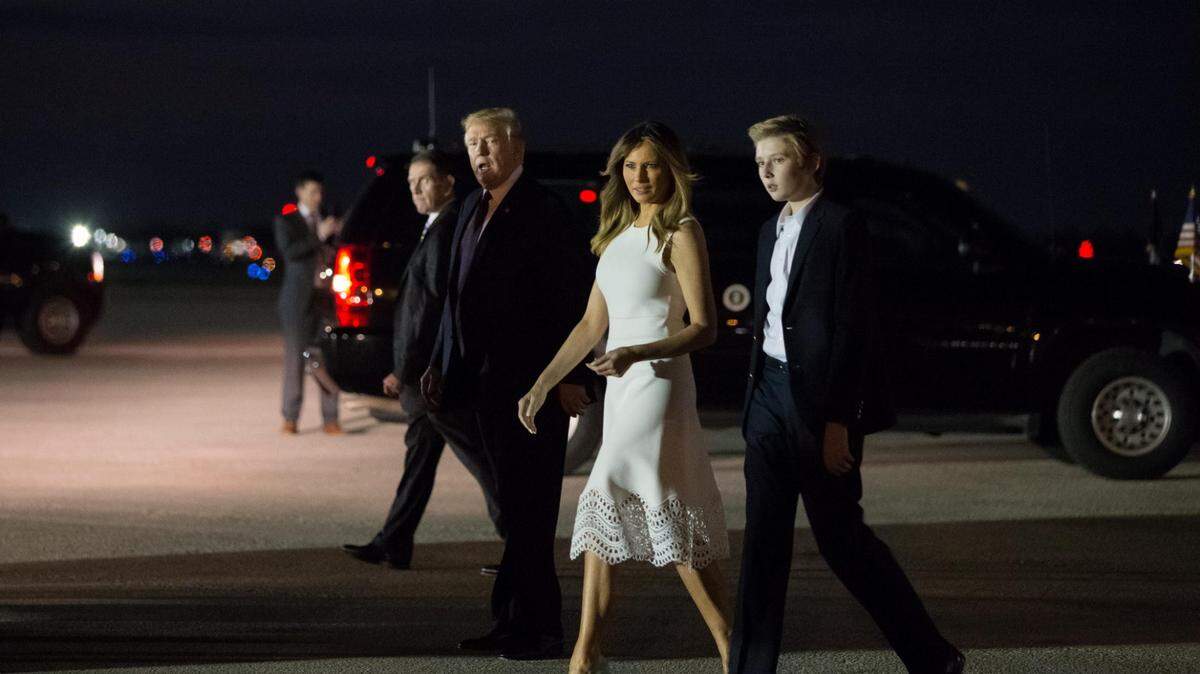File art: President Donald Trump, first lady Melania Trump and son Barron Trump walk toward the crowd gathered at Palm Beach International Airport in West Palm Beach, Fla., Tuesday, Nov. 20, 2018.