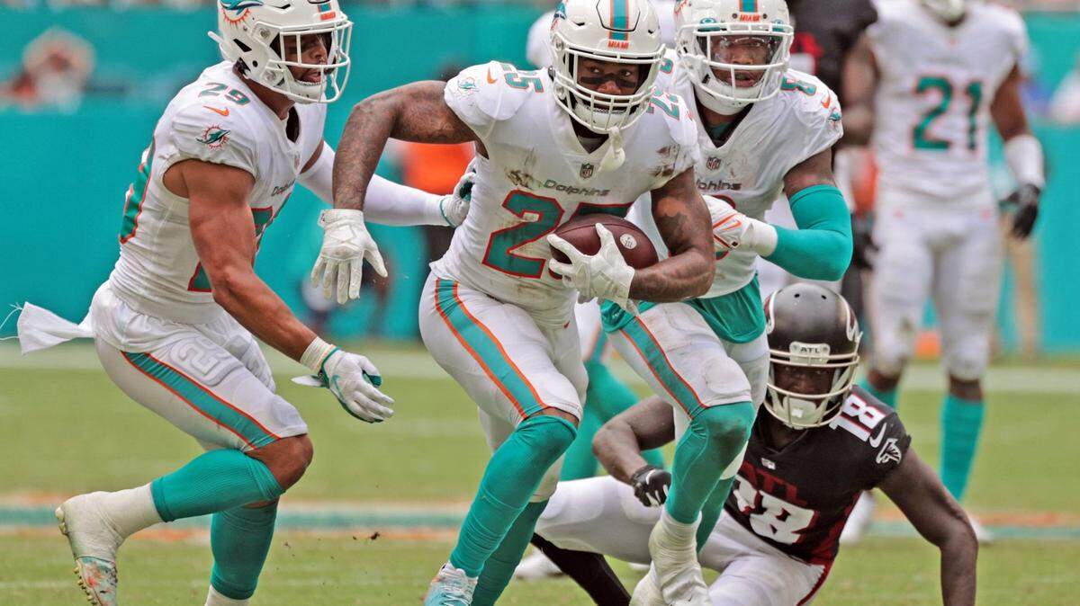 Miami Dolphins cornerback Xavien Howard (25) intercepts the ball intended for Atlanta Falcons wide receiver Calvin Ridley (18) in the third quarter at Hard Rock Stadium in Miami Gardens on Sunday, October 24, 2021.