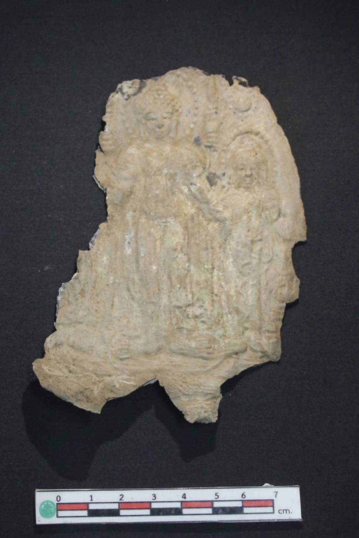 The second Buddha had attendants, but the piece was heavily damaged.