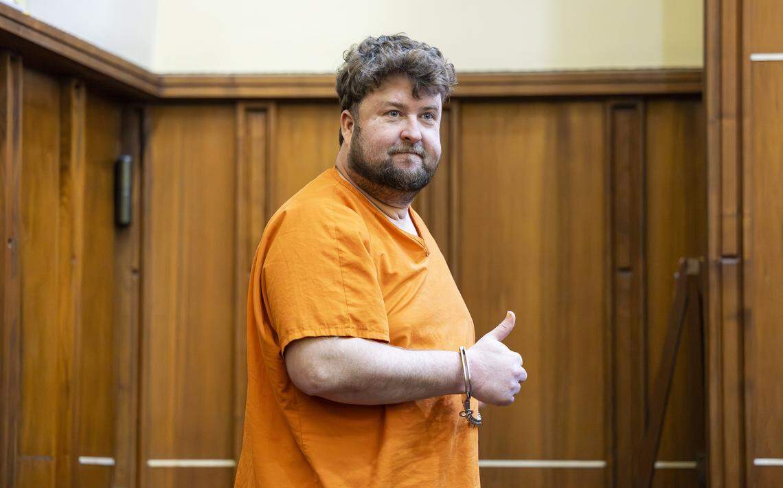 Travis Grafe, son of the former Knaus Berry Farms owners, reacts as he attends court for a competency hearing at the Richard E. Gerstein Justice Building on Friday, Sept. 26, 2025, in Miami, Fla. He is accused of beating his mother, Rachel Knaus Grafe, to death.