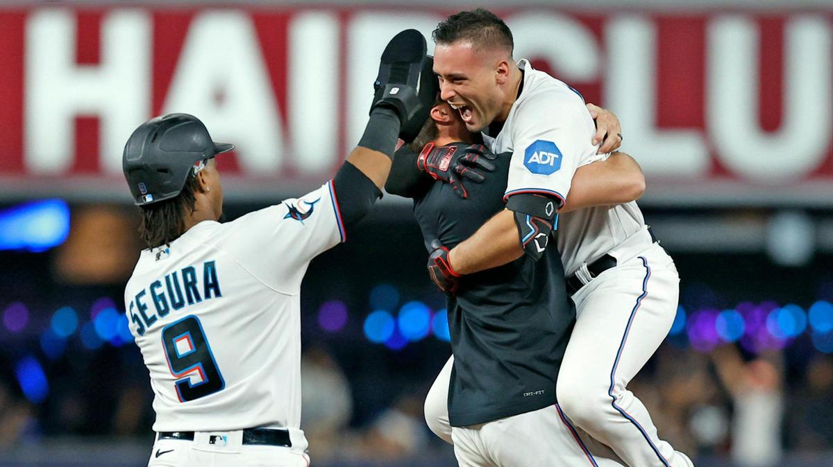 Miami Marlins catcher Nick Fortes (4) celebrates with teammates after Fortes singles on a ground ball and Jean Segura (9) scores in the ninth inning to win the game against the San Diego Padres at loanDepot Park in Miami on Wednesday, May 31, 2023.