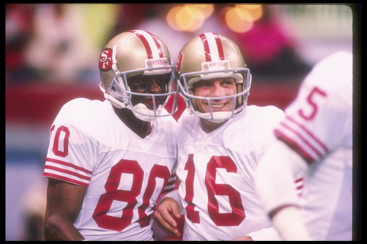 San Francisco 49ers wide receiver Jerry Rice and quarterback Joe Montana celebrate during the Super Bowl XXIV blasting of Denver.