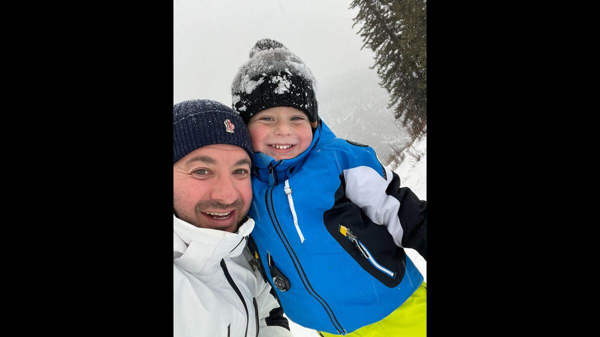 Mark Polyakov and his son, Samuel. He had been accused of threatening to burn down the Scheck Hillel Community School. On March 16, 2022, Miami-Dade prosecutors dropped the case against him.