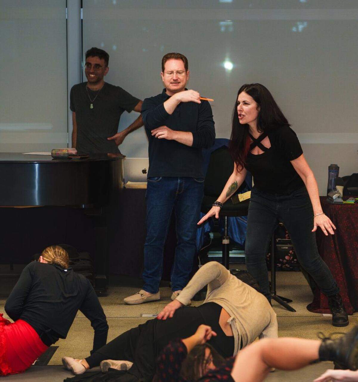 Maria Todaro in rehearsal directing a fight scene for Florida Grand Opera’s “Carmen.” Orchestra conductor Ramón Tebar looks on.