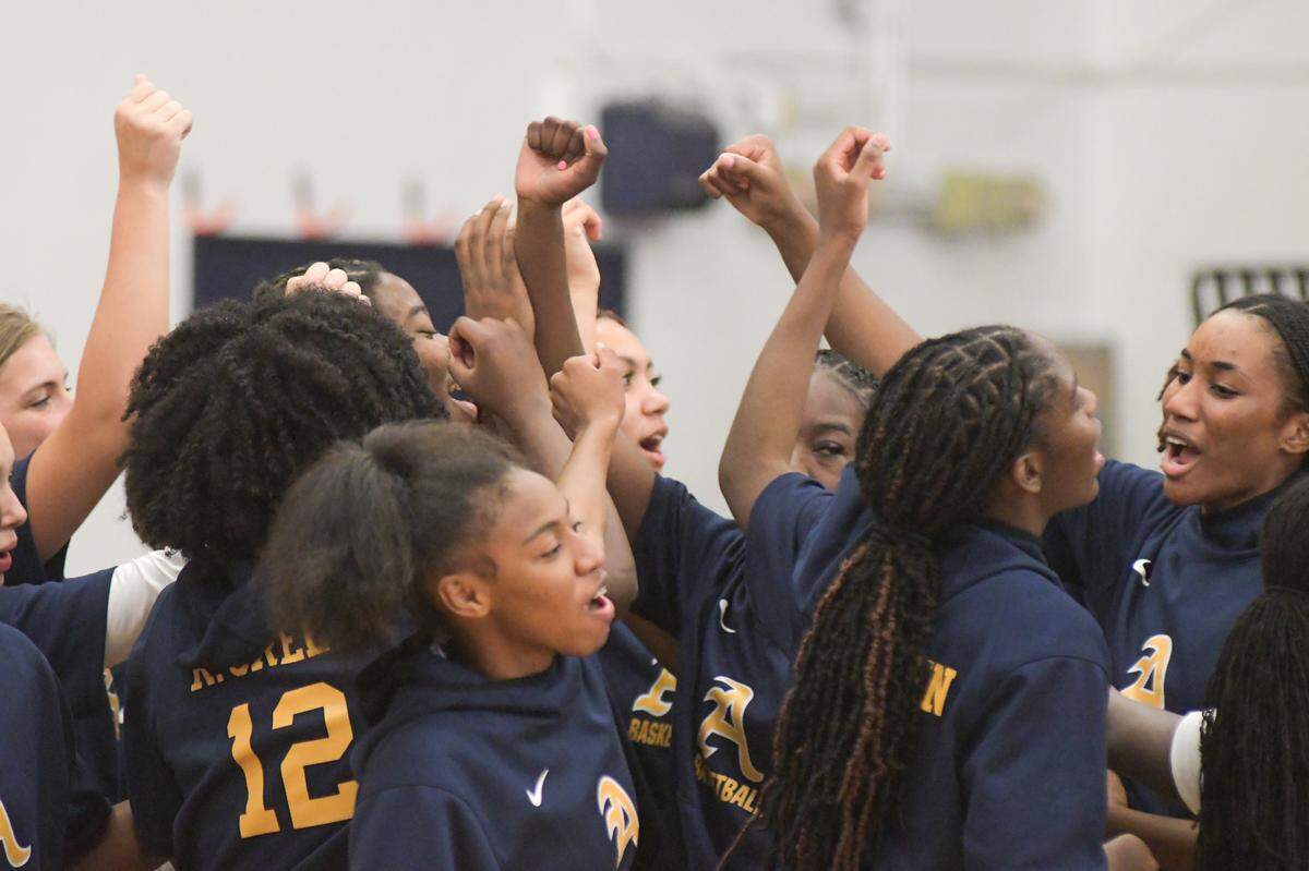 The St. Thomas Aquinas girls’ basketball team huddles prior to its regional semifinal game against Blanche Ely on Tuesday, Feb. 15, 2022, at St. Thomas Aquinas High in Fort Lauderdale, Florida.