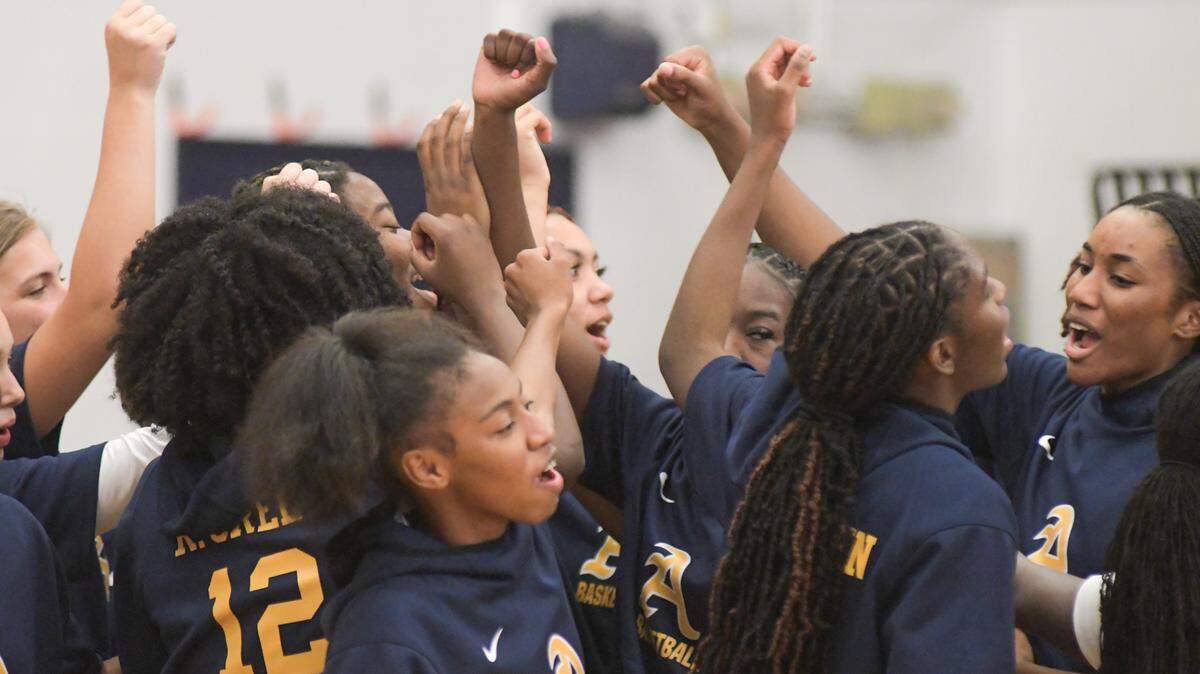 The St. Thomas Aquinas girls’ basketball team huddles prior to its regional semifinal game against Blanche Ely on Tuesday, Feb. 15, 2022, at St. Thomas Aquinas High in Fort Lauderdale, Florida.