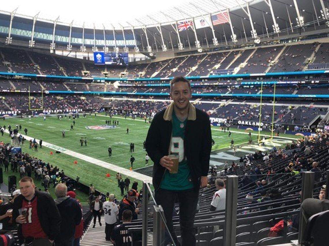 Jack Horwitz, a Dolphins fan in the United Kingdom, watches a 2019 game between the Raiders and Bears in a Cameron Wake jersey.