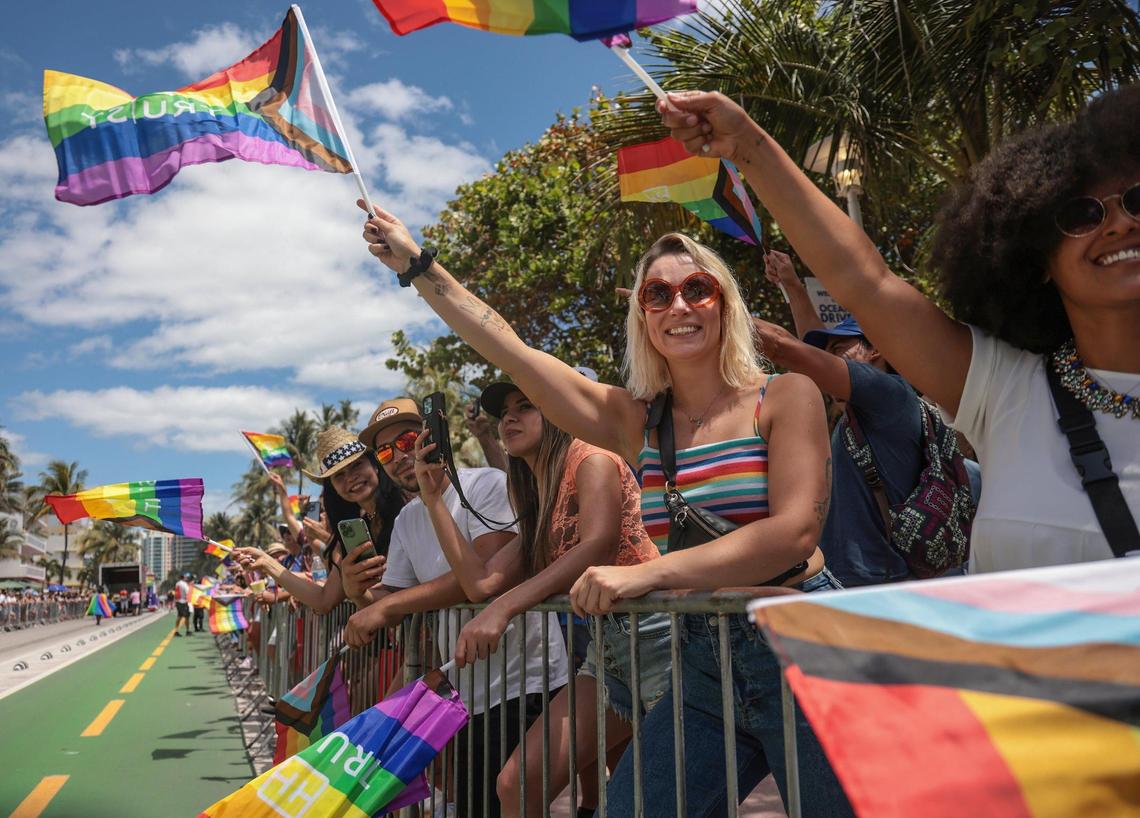 Attendees of the Pride Parade wave their rainbow flags in celebration of LGBTQ pride. The City of Miami Beach held its annual Pride Parade on Ocean Drive from Fifth to 15th streets on Sunday, April 10, 2022.