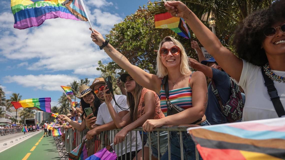 Attendees of the Pride Parade wave their rainbow flags in celebration of LGBTQ pride. The City of Miami Beach held its annual Pride Parade on Ocean Drive from Fifth to 15th streets on Sunday, April 10, 2022.