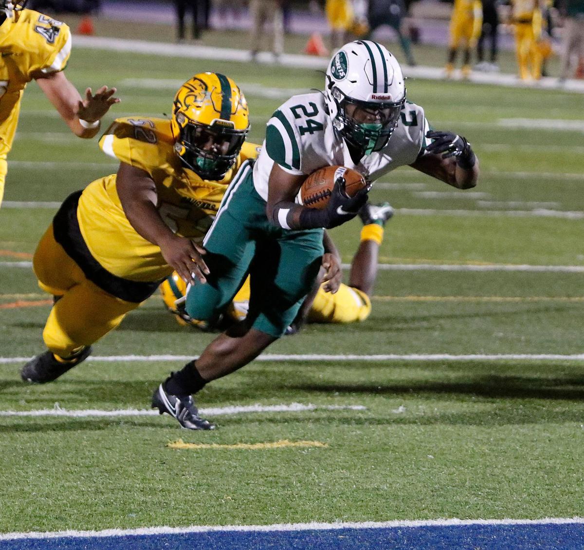 Miami Central Rockets running back Ean Pope (24) goes for a touchdown against Killian Cougars during the FHSAA Region 4-5A high school football championship on Saturday, November 27, 2021 at Tropical Park in Miami. Andrew Uloza / for THE MIAMI HERALD
