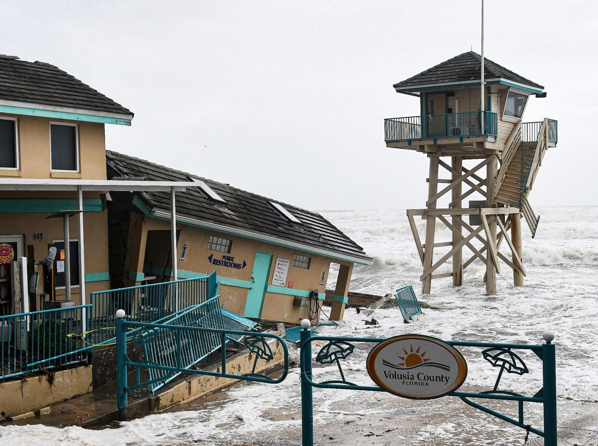 Waves crash near a damaged building and a lifeguard tower in Daytona Beach Shores, Florida as Tropical Storm Nicole makes its approach to the coast of Florida with an expected landfall as a category 1 hurricane. (Photo by Paul Hennessy / SOPA Images/Sipa USA)(Sipa via AP Images)