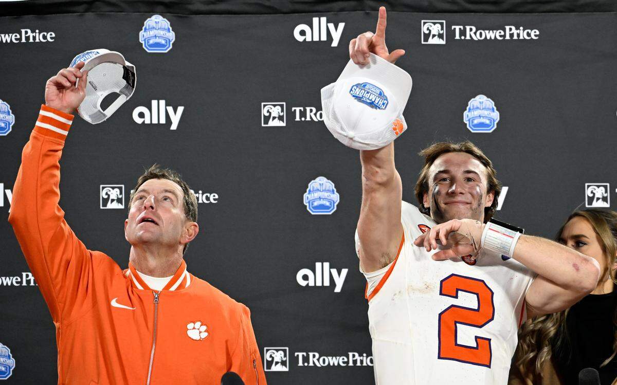 Dec 7, 2024; Charlotte, NC, USA; Clemson Tigers head coach Dabo Swinney, and quarterback Cade Klubnik (2) celebrate after winning the 2024 ACC Championship game against the Southern Methodist Mustangs at Bank of America Stadium.