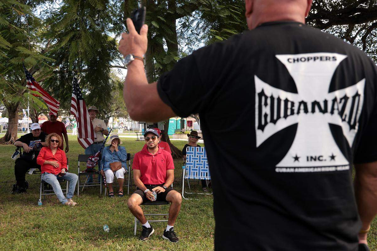 Wearing a shirt marked with an “Iron Cross”, a prominent Nazi symbol, a veteran who introduced himself only as “Raul” said the Pledge of Allegiance as GOP canvasser Christopher Monzon looked on.
