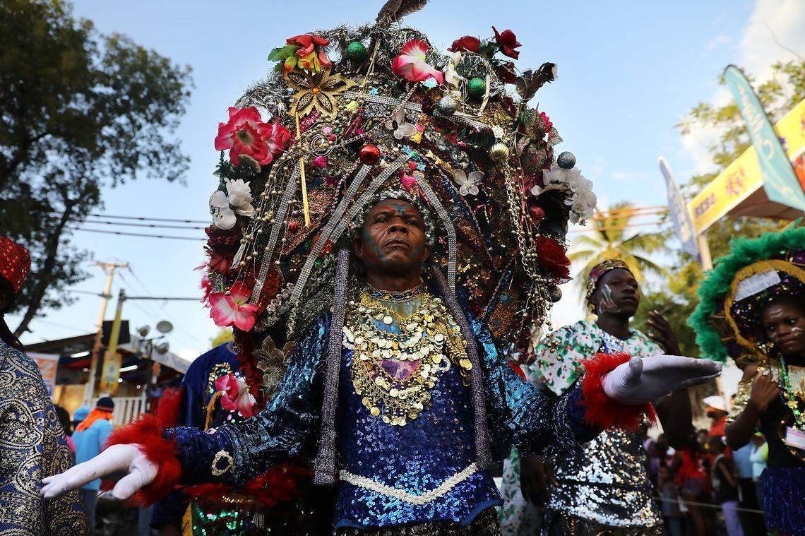 Performers march through the streets of Port-au-Prince during the last day of Carnival on February 13, 2018 in Port-au-Prince, Haiti.