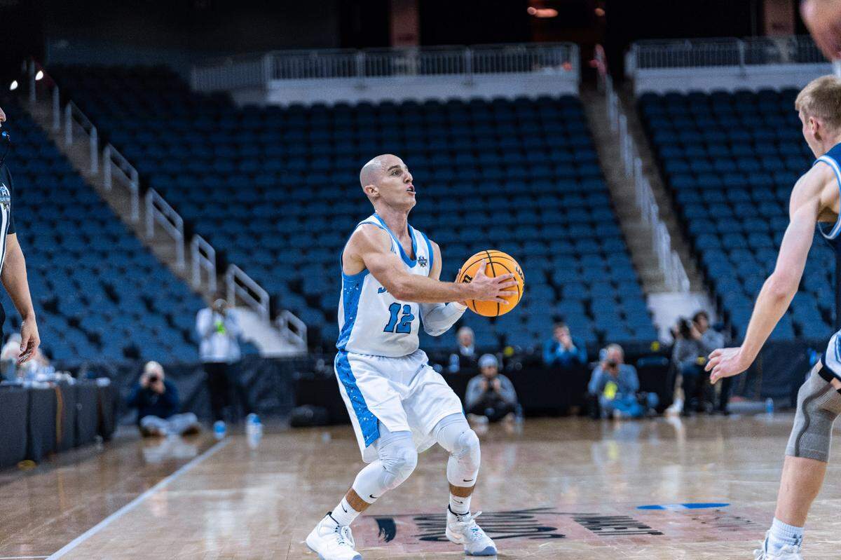 NSU guard Dallas Graziani squares up for a shot during the Sharks’ 94-68 win over Washburn University in an NCAA Division-II national semifinal on Thursday night in Evansville, Indiana.