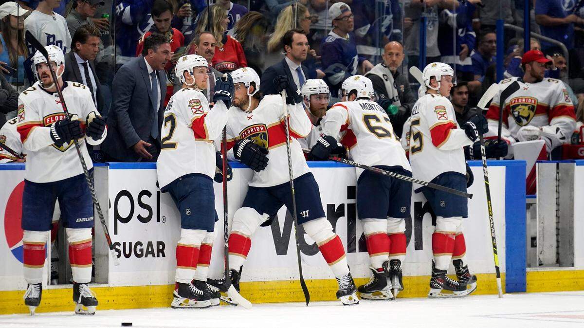 Members of the Florida Panthers wait during a video review on what was originally called a goal by Tampa Bay Lightning left wing Alex Killorn during the second period in Game 4 of an NHL hockey second-round playoff series Monday, May 23, 2022, in Tampa, Fla. The goal was overturned. (AP Photo/Chris O’Meara)