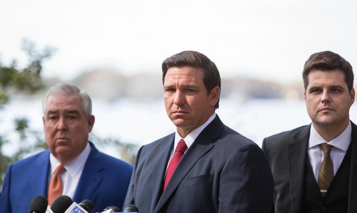 Governor Ron DeSantis, center, Orlando attorney John Morgan, left, and U.S. Congressman Matt Gaetz, during a press conference to pressure state legislators with a mid-March deadline to repeal a law that prohibits smokeable forms of medical marijuana at Kraft Azalea Garden in Winter Park, Thursday, Jan. 17, 2019.