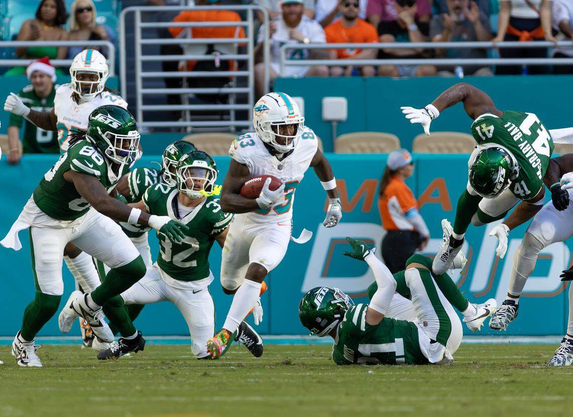Miami Dolphins wide receiver Malik Washington (83) runs after a punt during the second half of their NFL game against the New York Jets at Hard Rock Stadium on Sunday, Dec. 8, 2024, in Miami Gardens, Florida.