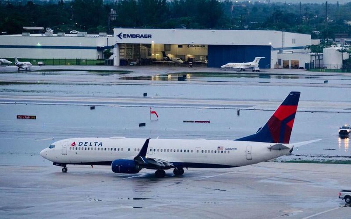 A flooded runway at Fort Lauderdale-Hollywood International Airport, as seen Monday morning, Dec. 23, 2019, after extremely heavy overnight rains, in this file photo.