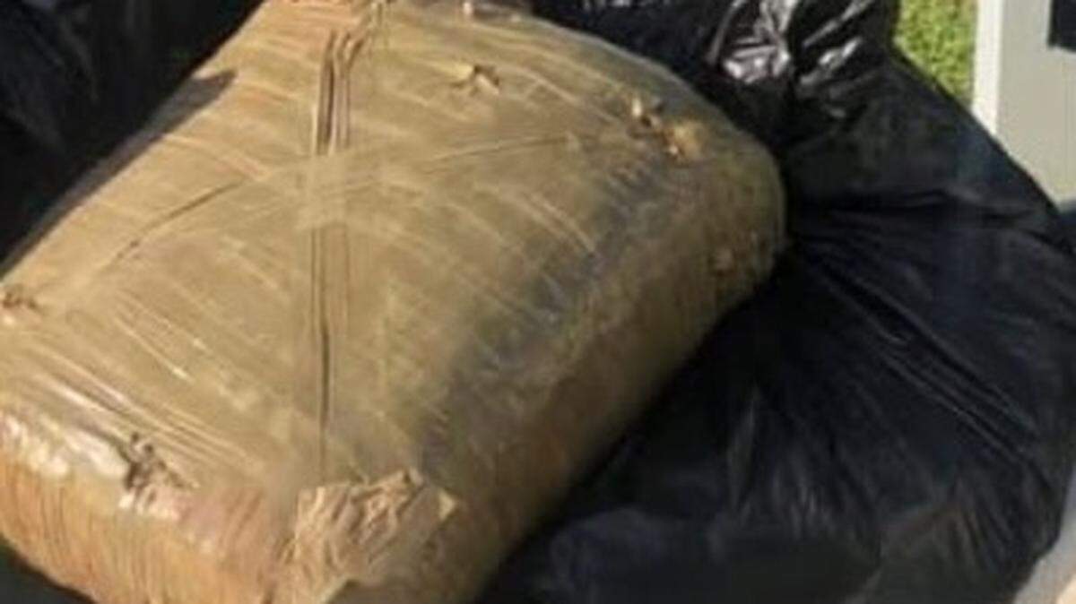 A 22-pound bale of marijuana sits among garbage student volunteers cleaned up in the mangroves of Islamorada in the Florida Keys Tuesday, April 23, 2019.