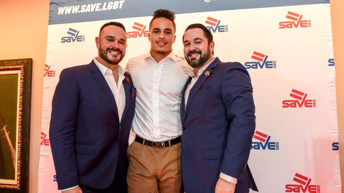 SAVE Executive Director Tony Lima, honoree Miami Dolphins wide receiver Kenny Stills and Lima’s fiancé, Yonel Galano, on Thursday, Sept. 13, at the 2018 SAVE Luminary Awards at Bacardi USA headquarters in Coral Gables.