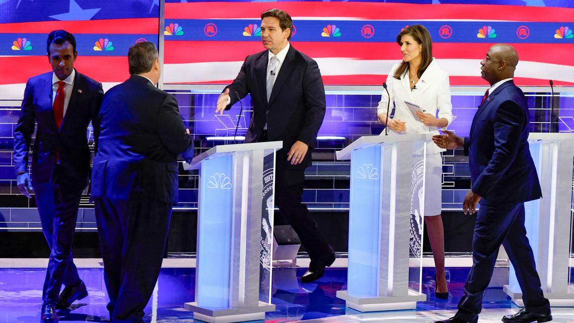 Former Gov. Chris Christie of New Jersey shakes the hand of Florida Gov. Ron DeSantis at the end of the third Republican presidential primary debate at the Adrienne Arsht Center for the Performing Arts of Miami-Dade County on Wednesday, November 8, 2023, in downtown Miami, Fla.