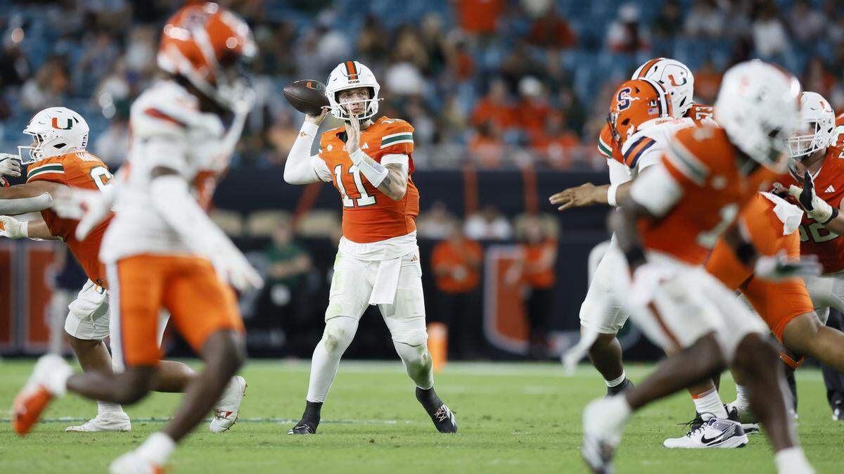 Miami Hurricanes quarterback Carson Beck (11) sets upp to pass against the Syracuse Orange in the second half of an NCAA football game at Hard Rock Stadium in Miami Gardens, Florida on Saturday, November 8, 2025.
