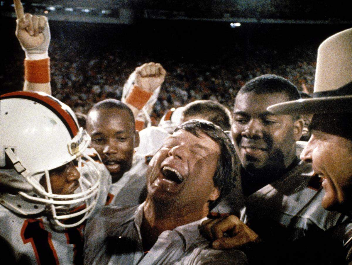 Jan. 1, 1988 -- Jimmy Johnson celebrates after winning the national championship against Oklahoma in the Orange Bowl.