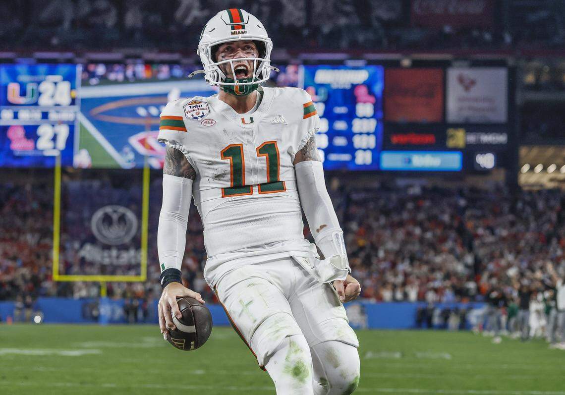 Miami Hurricanes quarterback Carson Beck (11) reacts after scoring during the second half of a College Football Playoff semifinal against the Mississippi Rebels in the Fiesta Bowl at State Farm Stadium on Friday, January 9, 2026 in Glendale, Arizona.