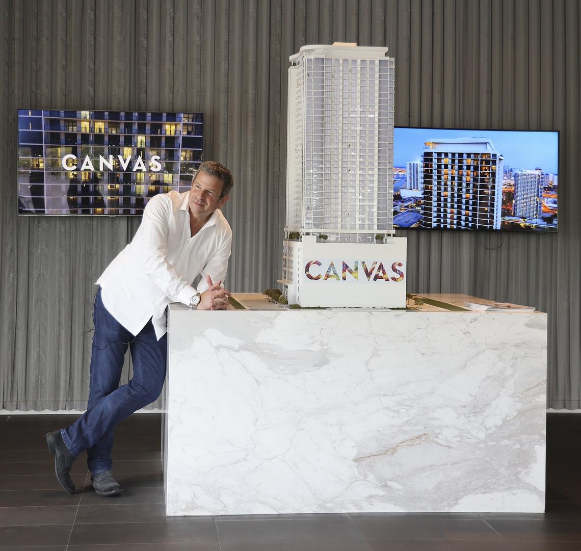 Developer Nir Shoshani, principal of NR Investments, stands next to a model of his new Canvas condo in Miami’s Omni District at the building’s sales center. Shoshani has proposed building a new city-subsidized project next door that would consist of 252 affordable and workforce apartments in a similar tower.