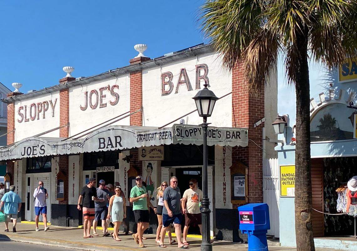 People walk along Duval Street in Key West on March 18, 2020.
