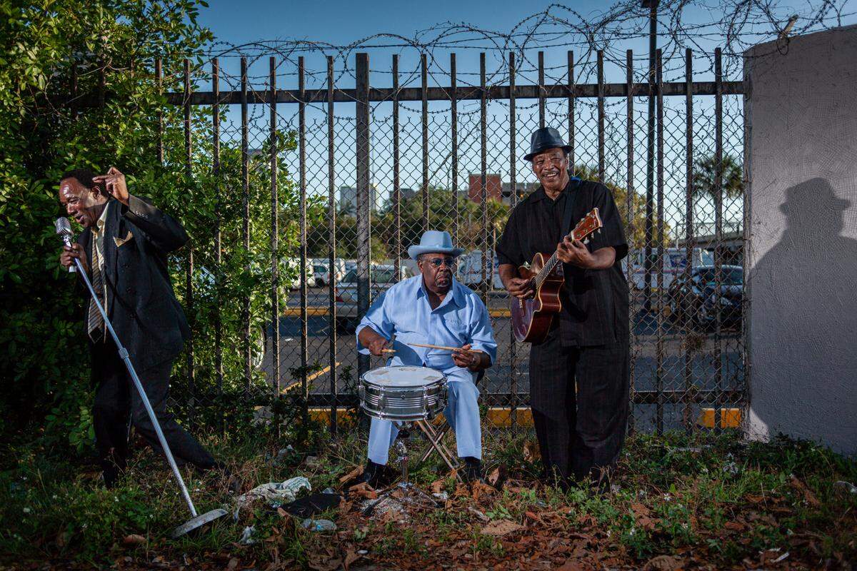 A series of photos taken by local photographer Greg Clark will be included as part of the “One Night Stand” series at Hampton Art Lovers Point Comfort Fair at Historic Ward Rooming House and Gardens during Miami Art Week. The photos taken as part the “I played here” series for Overtown Music Project, feature photos of former session players and performers.