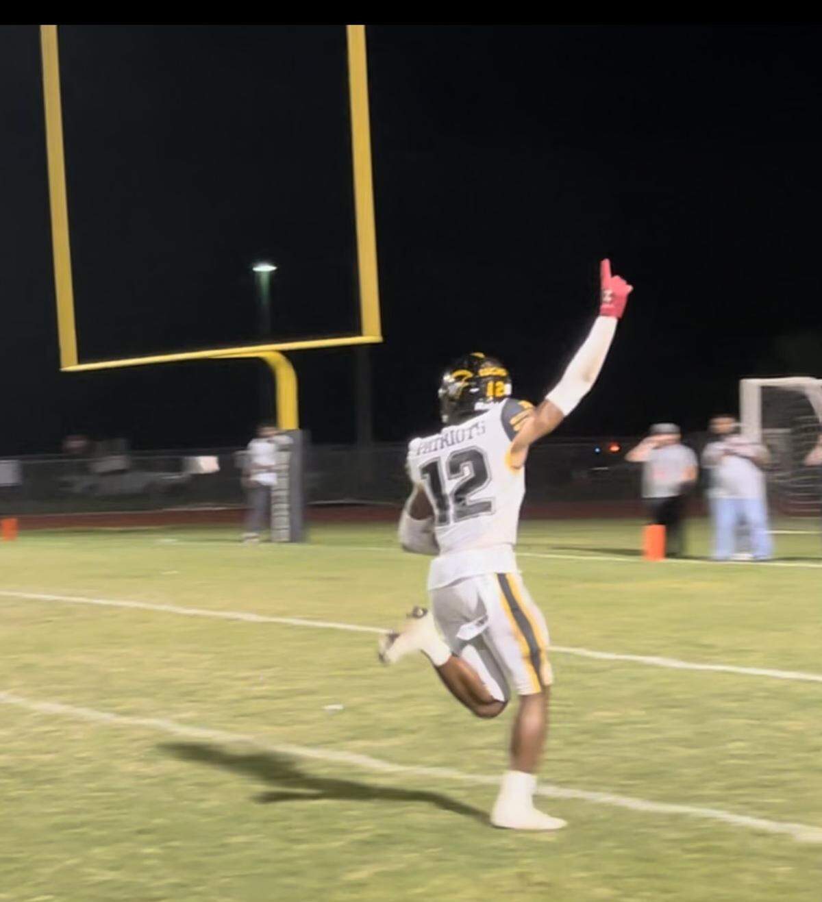 American Heritage cornerback Xavier Lucas celebrates after returning an interception for a touchdown that put the Patriots ahead for good in a win Friday night at Davie Western.