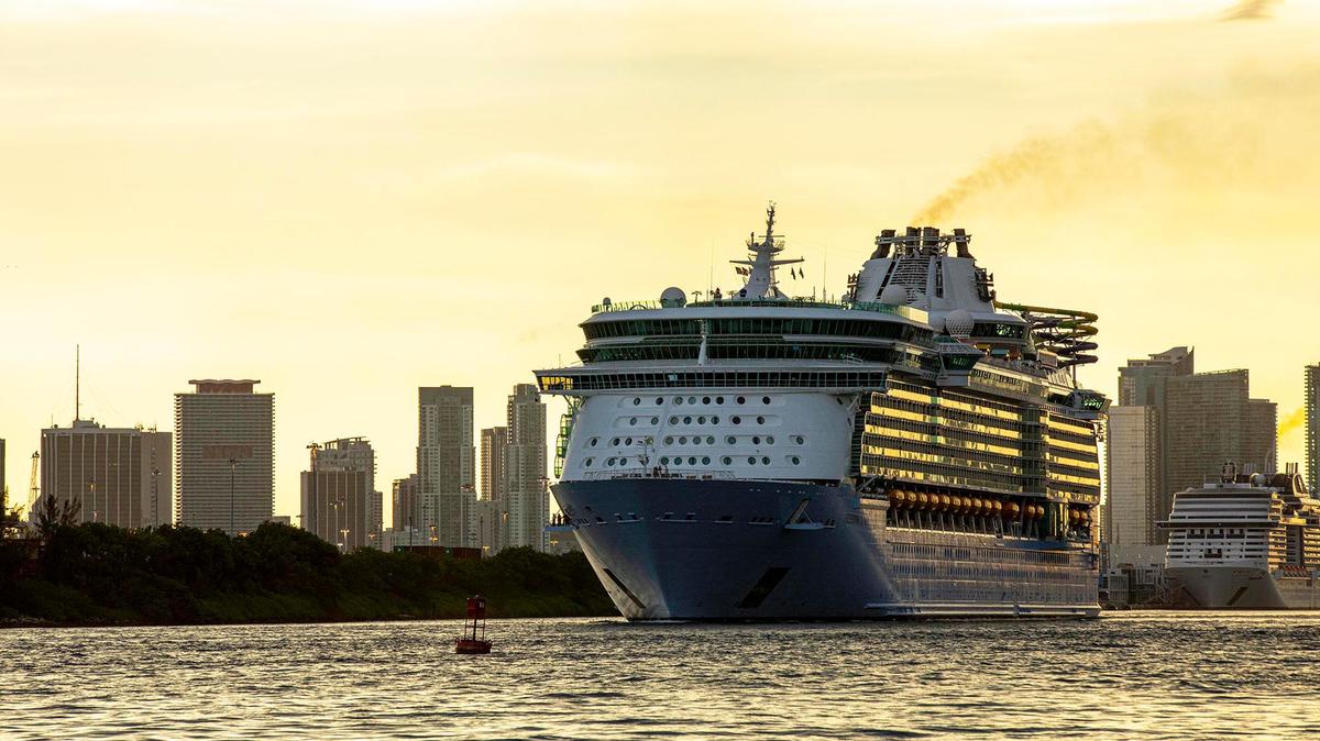 Royal Caribbean International’s Freedom of the Seas cruise ship sets off down Government Cut past South Pointe Park for a simulated voyage leaving from PortMiami in Miami, Florida, on Sunday, June 20, 2021.