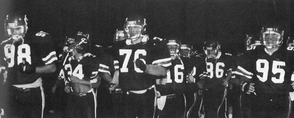 University of Miami head football coach Mario Cristobal (76) runs onto the field for a game during his playing days at his high school alma mater, Columbus High School.