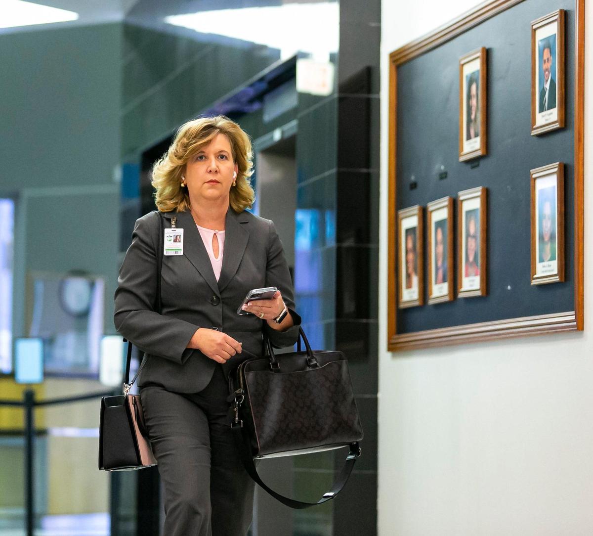 Broward Schools Superintendent Vickie Cartwright exits the Kathleen C. Wright Administration Center after Florida Gov. Ron DeSantis suspended four Broward County School Board members. As Cartwright left the building, she made her way past a black bulletin board only displaying the five remaining members on Friday, Aug. 26, 2022, in Fort Lauderdale, Fla.