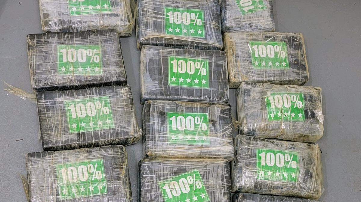 Packages of cocaine are displayed on a table. The Monroe County Sheriff’s Office said the approximately 70 pound load was found in the ocean off the Florida Keys Tuesday, Aug. 16, 2022.