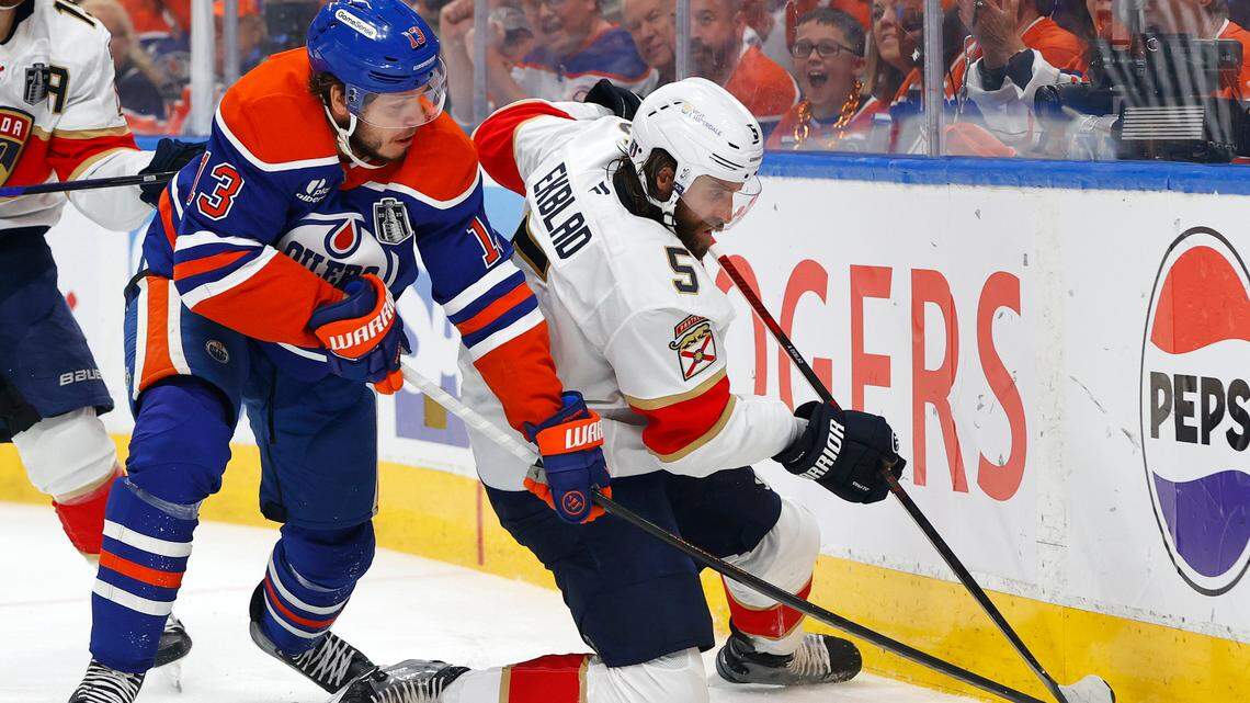 Jun 6, 2025; Edmonton, Alberta, CAN; Edmonton Oilers center Mattias Janmark (13) checks Florida Panthers defenseman Aaron Ekblad (5) during the first period in game two of the 2025 Stanley Cup Final at Rogers Place.