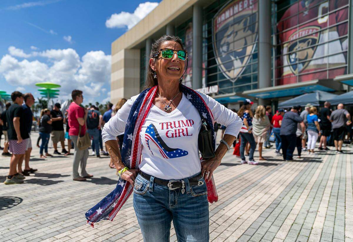 Kim Woodward, a Donald Trump supporter, is photographed as people arrive to the American Freedom Tour at the FLA Live Arena in Sunrise, Florida on Saturday, March 19, 2022.