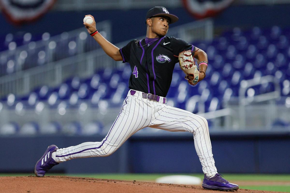 Southwest Miami Eagles starting pitcher Jesus Moreno (4) delivers a pitch against the Miami Springs Hawks during the first inning of a high school baseball game part of the Field of Dreams Program at loanDepot park in Miami, Florida, Tuesday, April 11, 2023. The Field of Dreams Program gives local high school baseball teams the opportunity to play a game at loanDepot park.