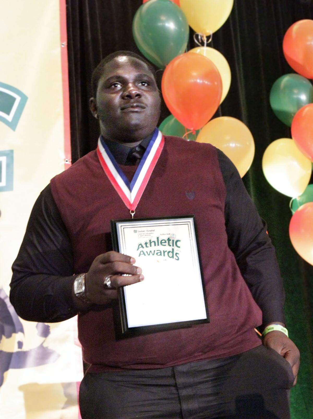 Carl Pierre-Louis, offensive lineman at Felix Varela High, accepts the Leo Suarez/Walter Krietsch Courage Award during the Miami Herald All-Dade Athletic Awards 2012 presented by the Orange Bowl on Friday, May 25, 2012, at Jungle Island.
