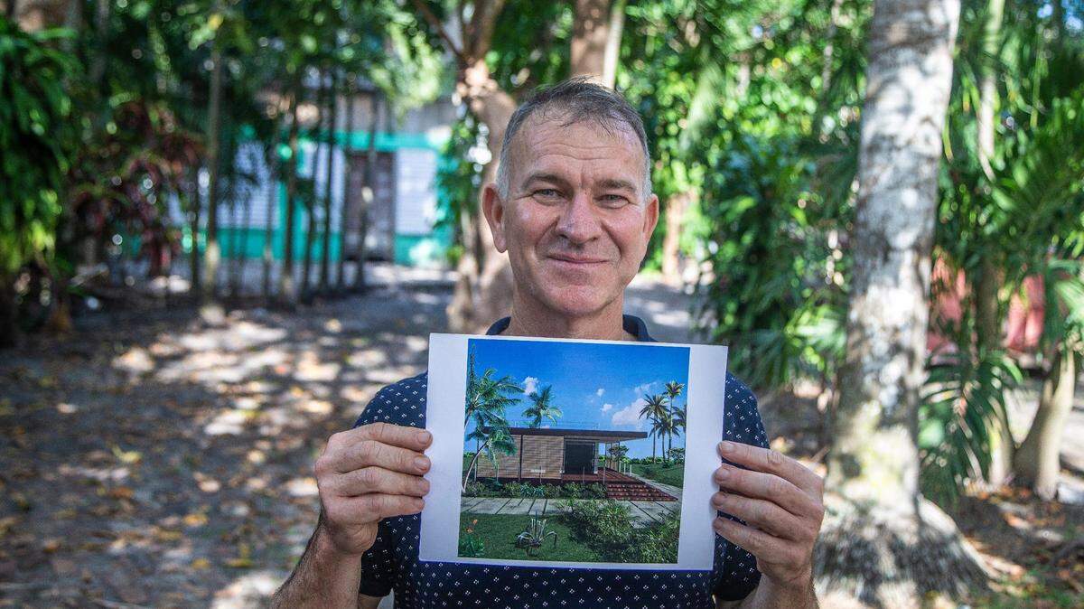 Gabriele Campana displays a rendering of the prototype house of his concept for prefabricated homes on May 11, 2021. The picture was taken at the site where the prototype home is scheduled to be unveiled in February 2022 as an addition to an existing home in South Miami.