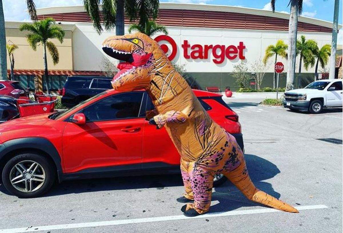 Sebastian Dominguez goes to Super Target in Davie in a dinosaur suit on March 31, 2020
