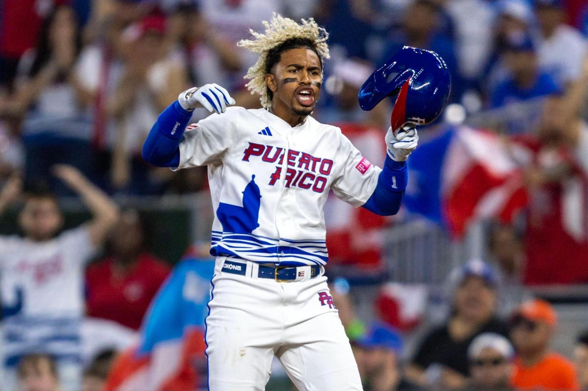 Puerto Rico base runner Francisco Lindor (12) reacts to a hit during the first inning of a 2023 World Baseball Classic game against Nicaragua at loanDepot Park in Miami, Florida, on Saturday, March 11, 2023.