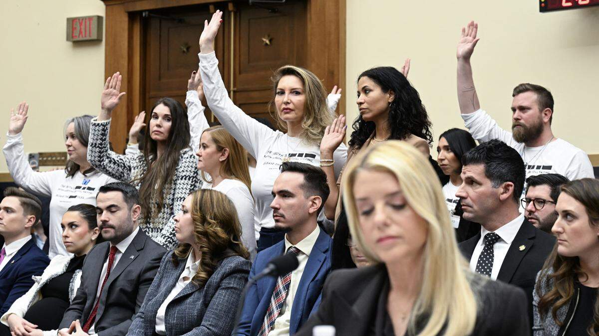 Victims of convicted sex offender Jeffrey Epstein react as U.S. Attorney General Pam Bondi testifies before a House Judiciary Committee hearing in Washington, D.C, on Feb. 11, 2026..