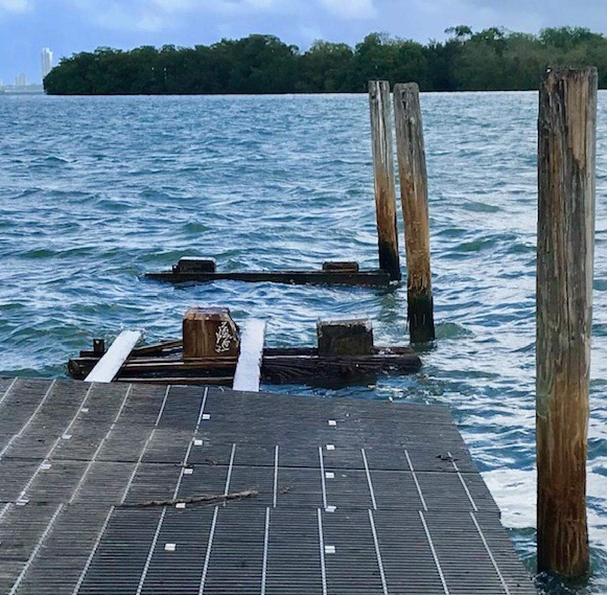 The public boat ramp and dock on the bay at Northeast 64th Street have remained unrepaired and fenced off for 10 years, neighbors say.